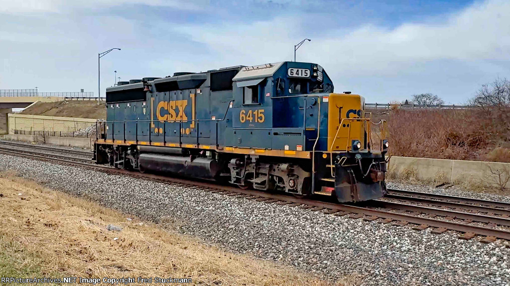 CSX 6415 leads L320 light.